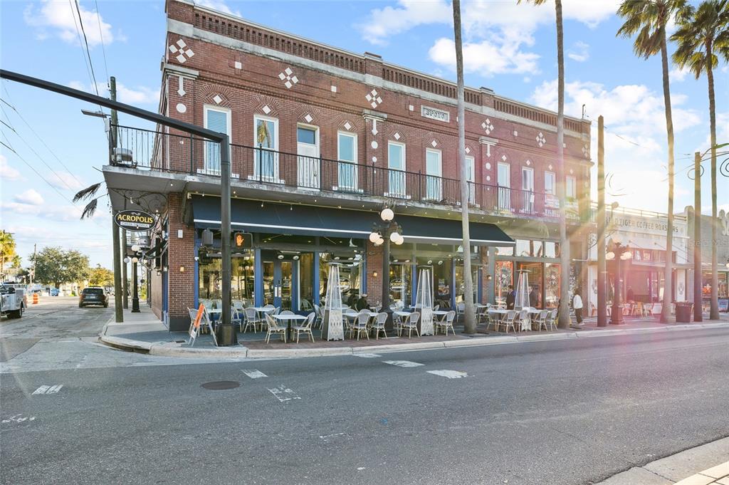A two-story brick building with a restaurant on the ground floor and a balcony above — 1829 E 7TH AVENUE, TAMPA, FL