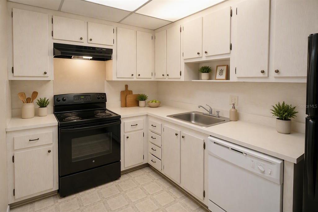 A kitchen with white cabinets, black appliances, a white dishwasher, and light-colored countertops — 4610 W GRAY STREET UNIT 307, TAMPA, FL