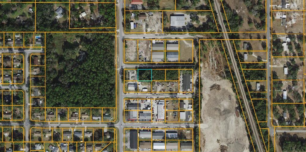 This is an aerial map showing a highlighted rectangular plot of land in a neighborhood — NE 44TH LANE, OCALA, FL