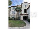 A three-story apartment building with a palm tree in front and a paved walkway — 827 CAMARGO WAY UNIT 307, ALTAMONTE SPRINGS, FL