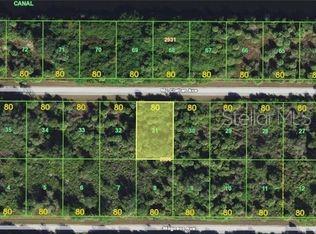 This aerial map shows a highlighted rectangular plot of land surrounded by other vacant lots — 14180 MAGNESS AVENUE, PORT CHARLOTTE, FL