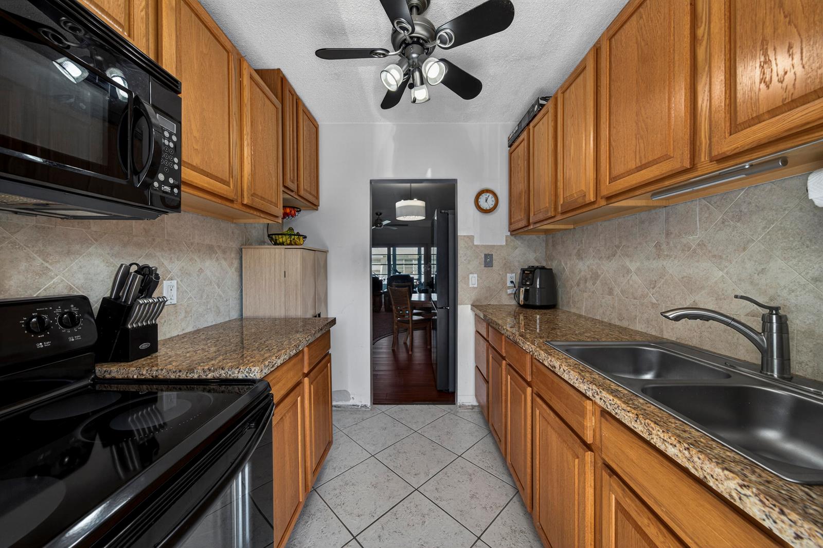 A bedroom features a bed, a television on a stand, and an attached bathroom — 2475 W Golf Boulevard # 247, Pompano Beach FL 33064, POMPANO BEACH, FL