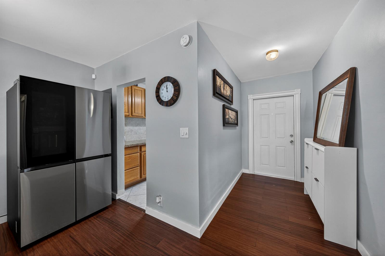 A bedroom with sage green walls, wood flooring, a ceiling fan, and a cat-print bedspread — 2475 W Golf Boulevard # 247, Pompano Beach FL 33064, POMPANO BEACH, FL