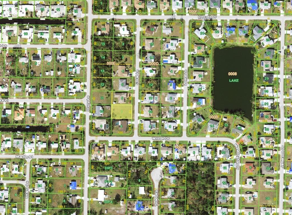 An aerial view shows a vacant rectangular lot outlined in red between two residential houses — 1274 CORAL LANE, ENGLEWOOD, FL