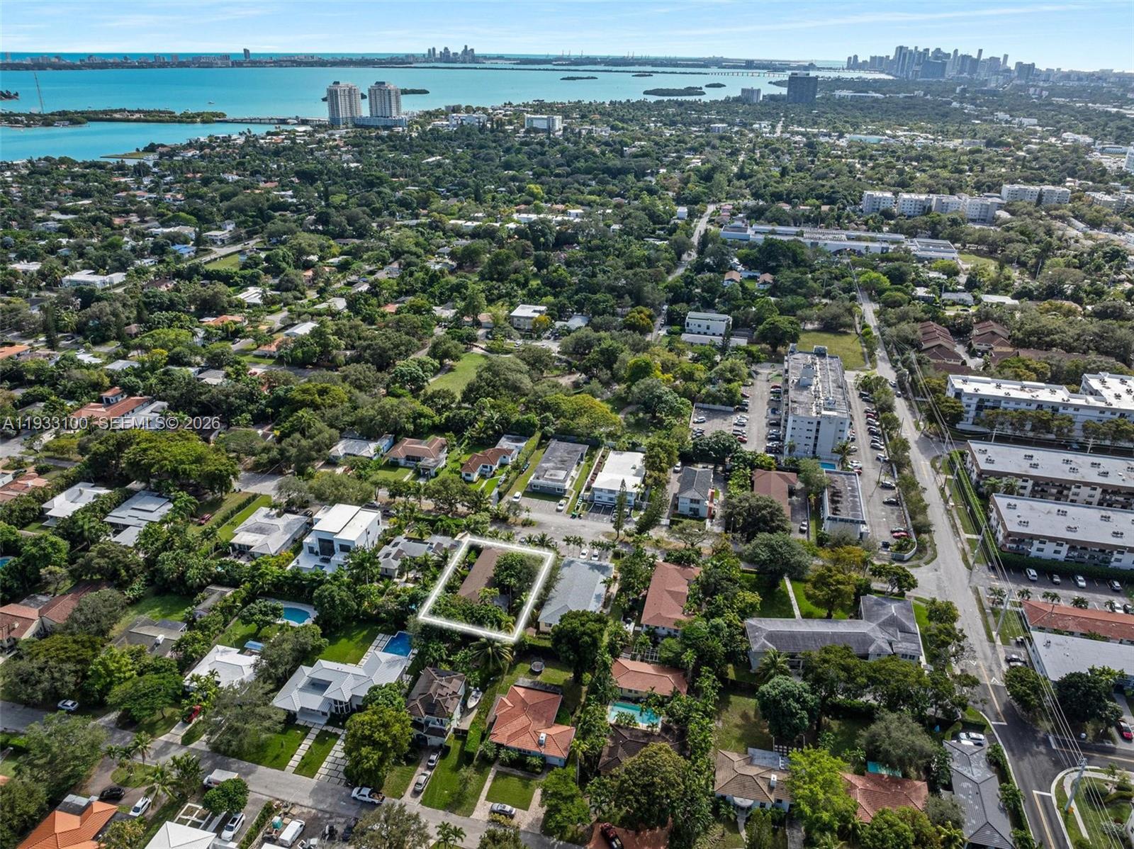 An aerial view shows a residential neighborhood with a highlighted house and surrounding greenery — 859 NE 90th St, Miami FL 33138, MIAMI, FL