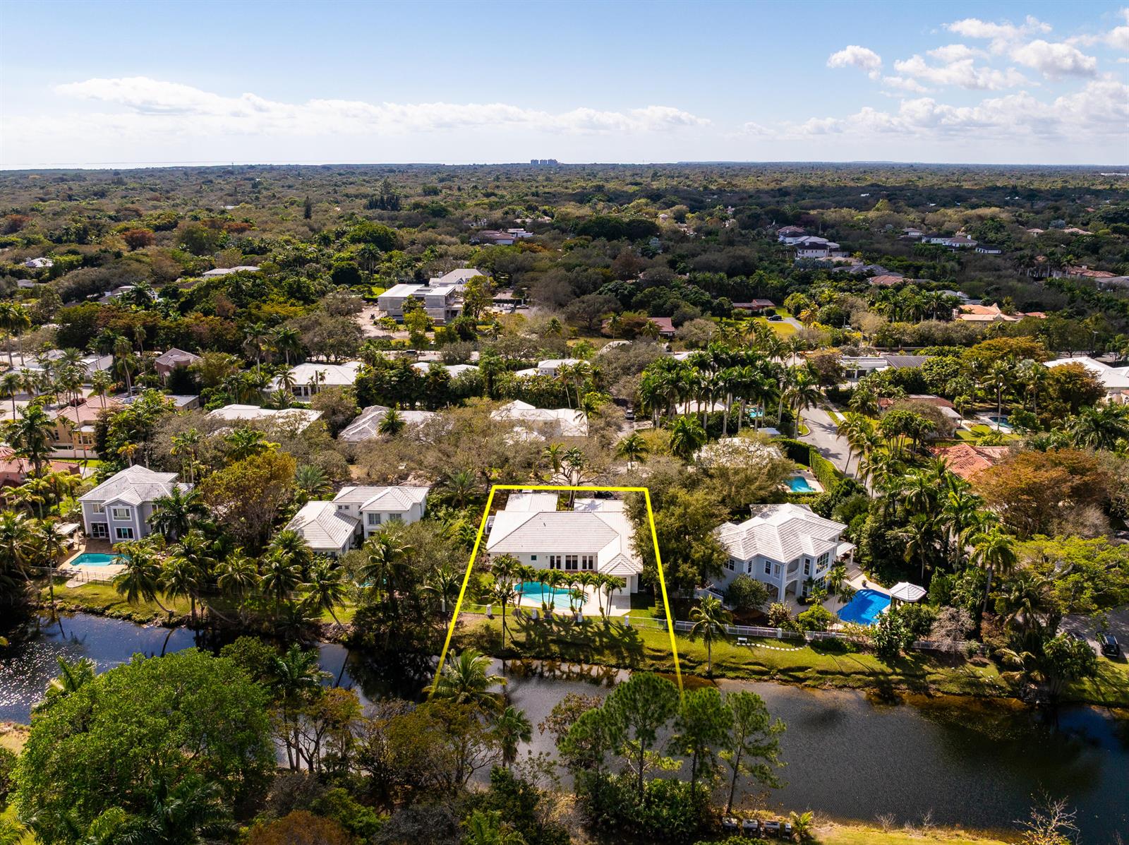 An aerial view shows a waterfront house with a swimming pool outlined in yellow — 6371 SW 87th Terrace, Pinecrest FL 33156, PINECREST, FL