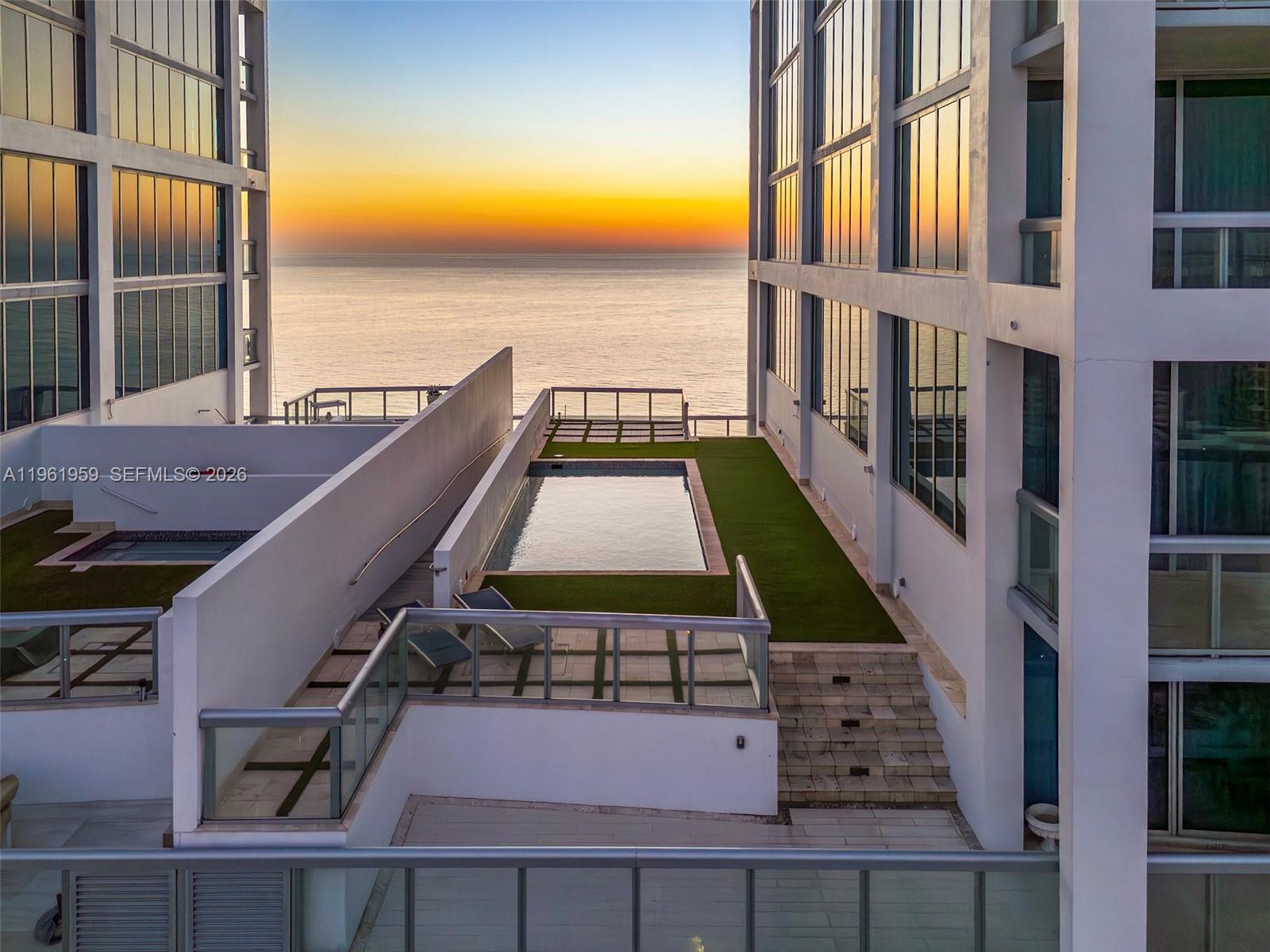 An elevated outdoor terrace features a small rectangular pool, artificial turf, and ocean views — 6899 Collins Ave, Miami Beach FL 33141, MIAMI BEACH, FL
