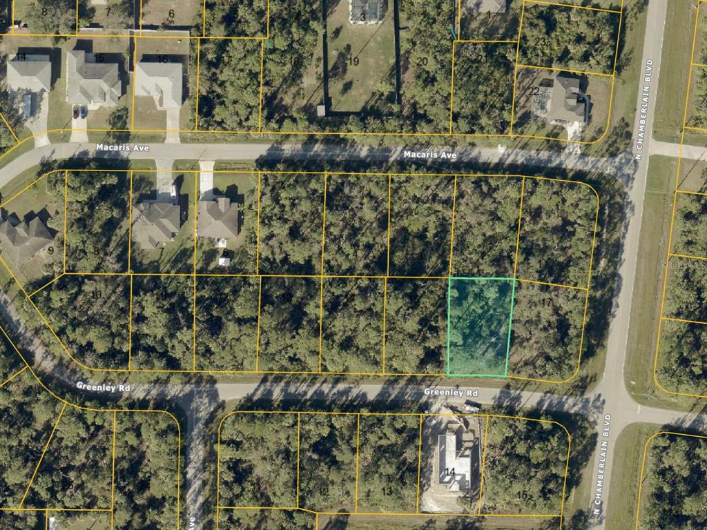 This is an aerial map showing a vacant, wooded residential lot highlighted in light blue — 0 GREENLEY ROAD, NORTH PORT, FL