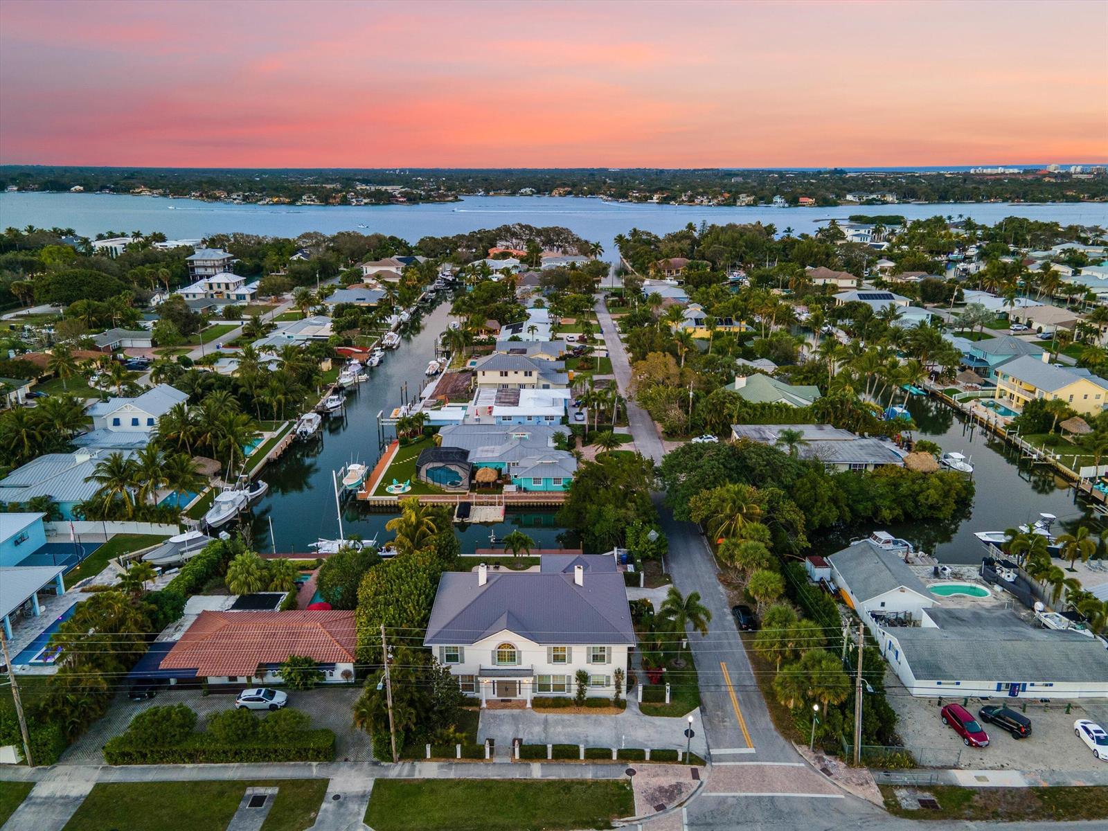 An aerial view shows a waterfront house with a gray roof near a canal — 401 Center Street, Jupiter FL 33458, JUPITER, FL