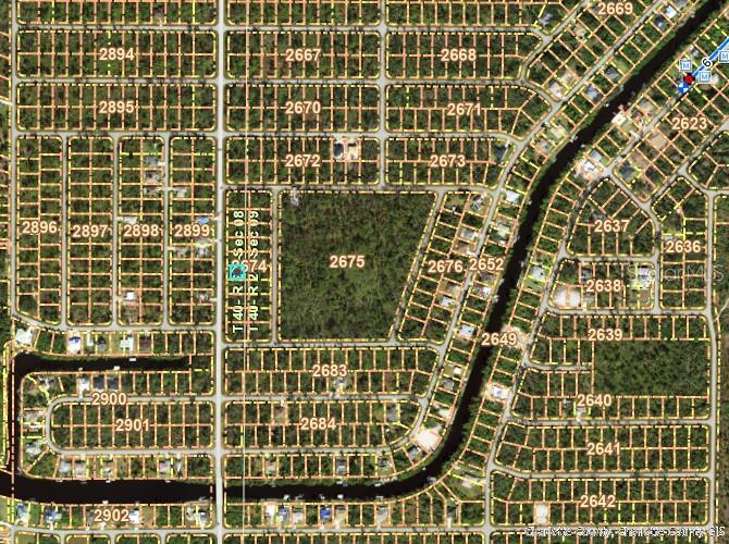This is an aerial map showing a residential neighborhood with numbered land parcels and canals — 1296 JACOBS STREET, PORT CHARLOTTE, FL