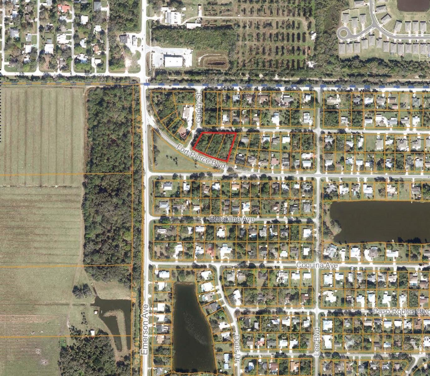 This is an aerial map showing a highlighted vacant lot located near a residential neighborhood — 8702 Fort Pierce Boulevard, Fort Pierce FL 34951, FORT PIERCE, FL