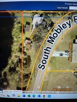This is a satellite map view showing a property parcel along South Mobley Road — 8841 S MOBLEY ROAD, ODESSA, FL