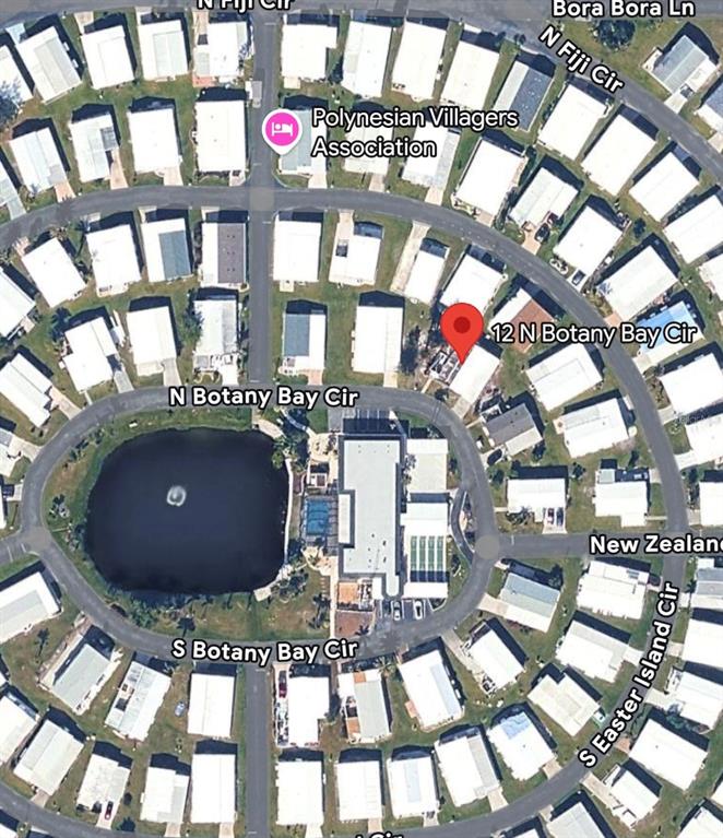 This is an aerial map view of a residential neighborhood with a central pond — 12 N BOTANY BAY CIRCLE, ENGLEWOOD, FL