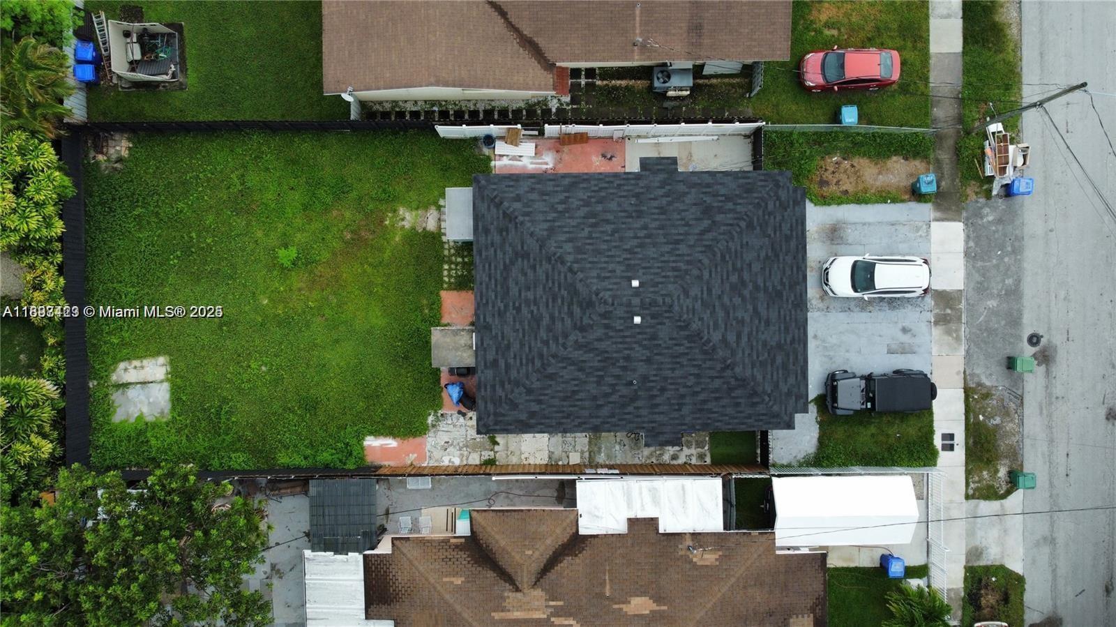 An aerial view shows a house with a dark shingled roof, driveway, and backyard — 2783 - 2785 SW 33rd Ct, Miami FL 33133, MIAMI, FL