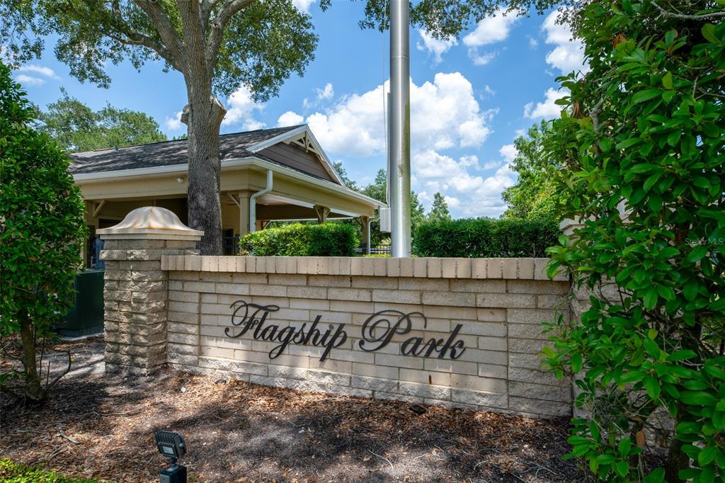 A stone wall with the words Flagship Park stands in front of a park pavilion — 3221 SAN JACINTO CIRCLE UNIT 3221, SANFORD, FL