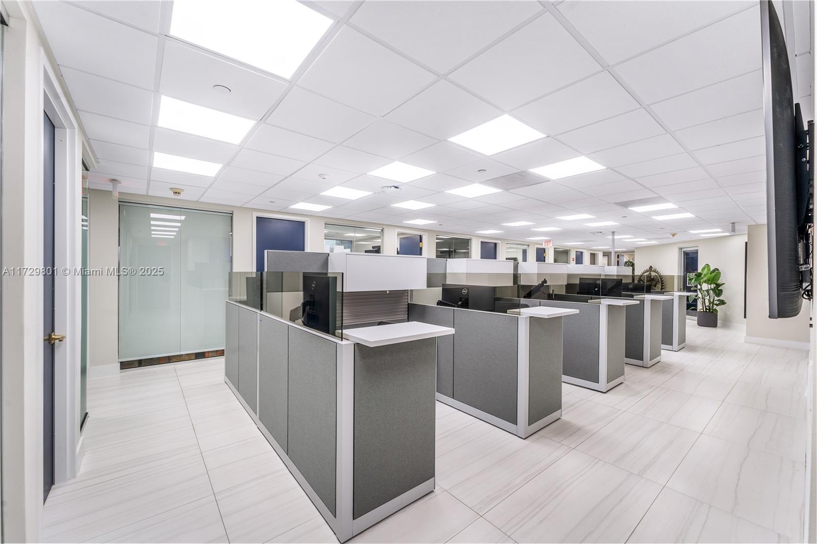 An office space features rows of gray cubicles on a white tiled floor — 1200 Brickell Ave # A, Miami FL 33131, MIAMI, FL