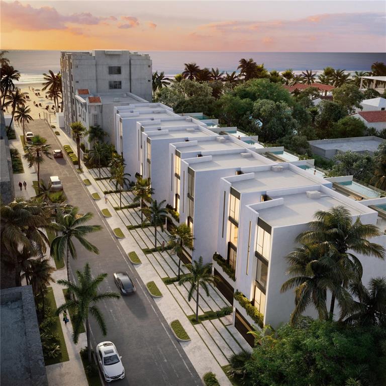 This is a rendering of a row of modern white townhouses near a beach — The Grove 11E CARRION COURT, SAN JUAN, PR