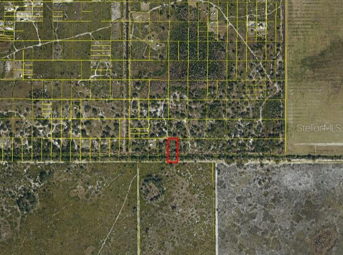 An aerial map view shows a rectangular property outlined in red within a rural area — SUBURBAN ESTS SEC 31...5224 002N, ST CLOUD, FL