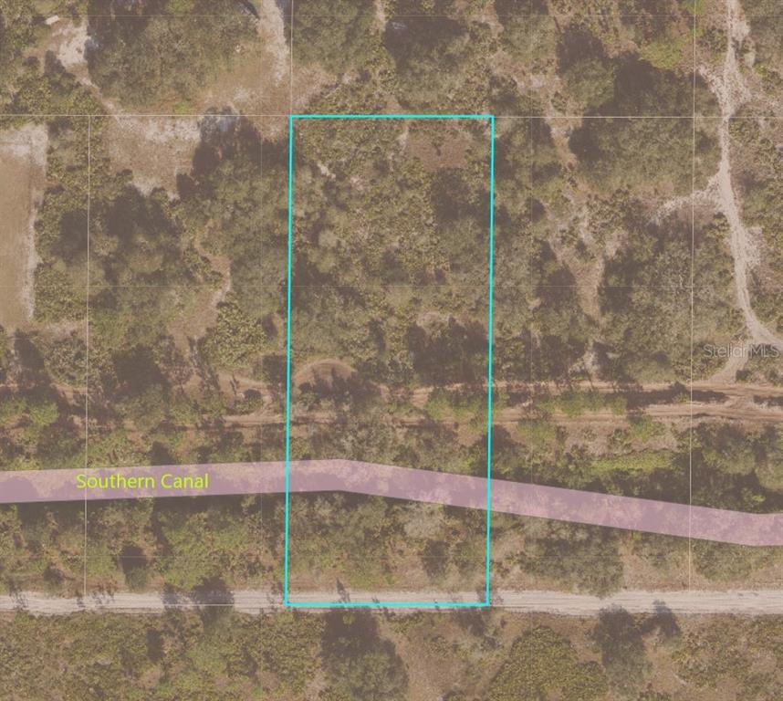 This is an aerial map showing a rectangular plot of land bordering a canal — SUBURBAN ESTS SEC 31...5224 002N, ST CLOUD, FL