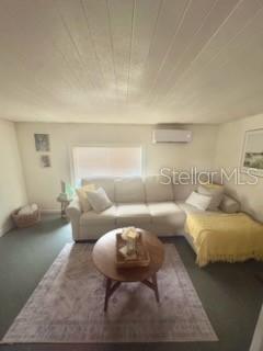 A living room features a beige sectional sofa, a round wooden coffee table, and a rug — 13494 61ST WAY N, CLEARWATER, FL