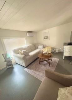 A living room features a white sofa, a round wooden coffee table, and a patterned rug — 13494 61ST WAY N, CLEARWATER, FL