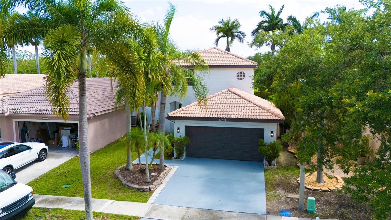 An aerial view shows a two-story house with a tiled roof and a garage — 17731 SW 23rd St, Miramar FL 33029, MIRAMAR, FL