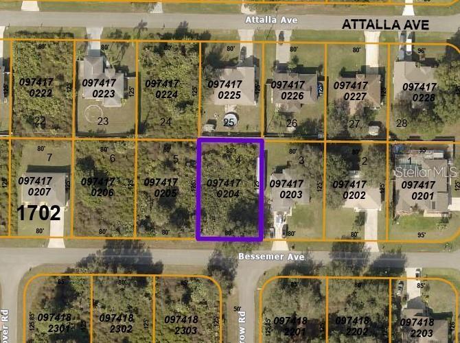 This is a satellite map view showing a highlighted vacant residential lot — BESSEMER AVENUE, NORTH PORT, FL