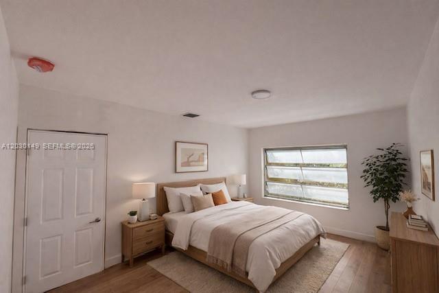 A bedroom features a queen bed, two nightstands, a window, and a white door — 6875 NW 4th Ave, Miami FL 33150, MIAMI, FL