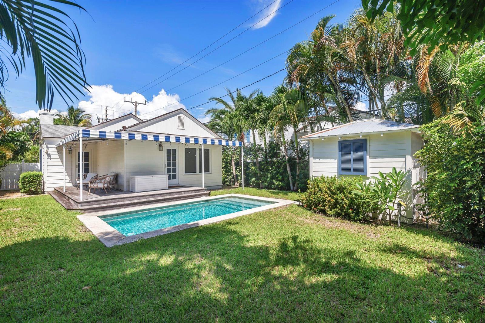 A backyard features a swimming pool, a wooden deck, and a small detached shed — 231 Cocoanut Row, Palm Beach FL 33480, PALM BEACH, FL