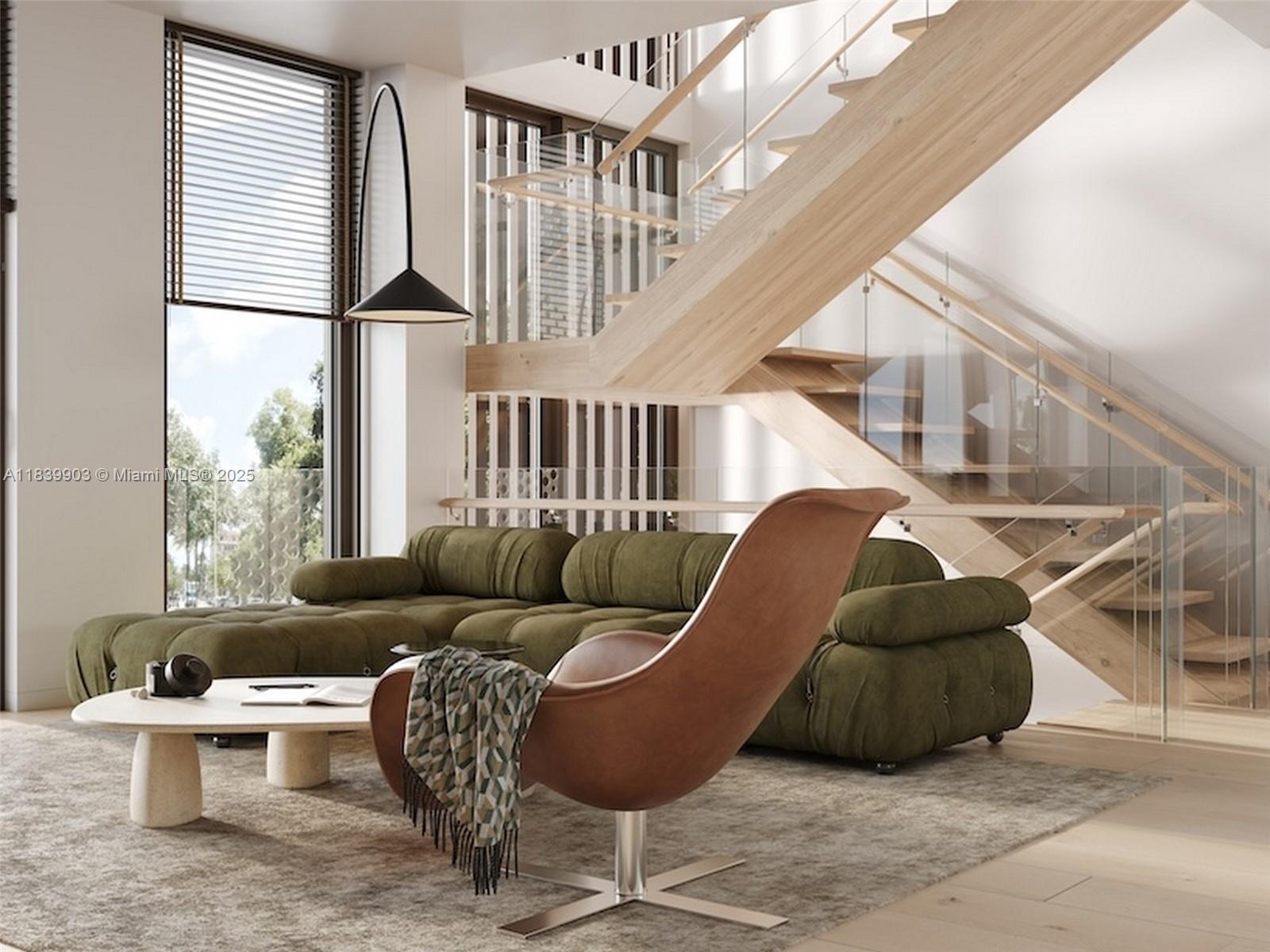 This is a rendering of a modern living room featuring a green sofa and staircase — 1709 Jefferson Ave # 08, Miami Beach FL 33139, MIAMI BEACH, FL