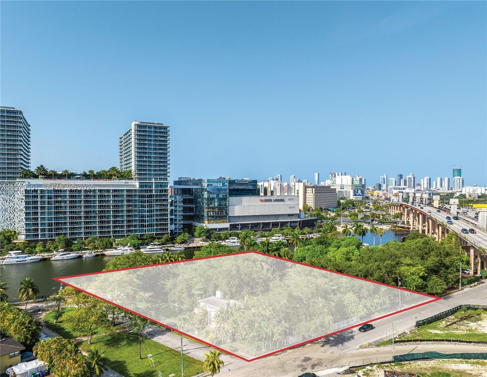 An aerial view shows a rectangular plot of land highlighted in red near a river — 1515 NW North River Dr, Miami FL 33125, MIAMI, FL
