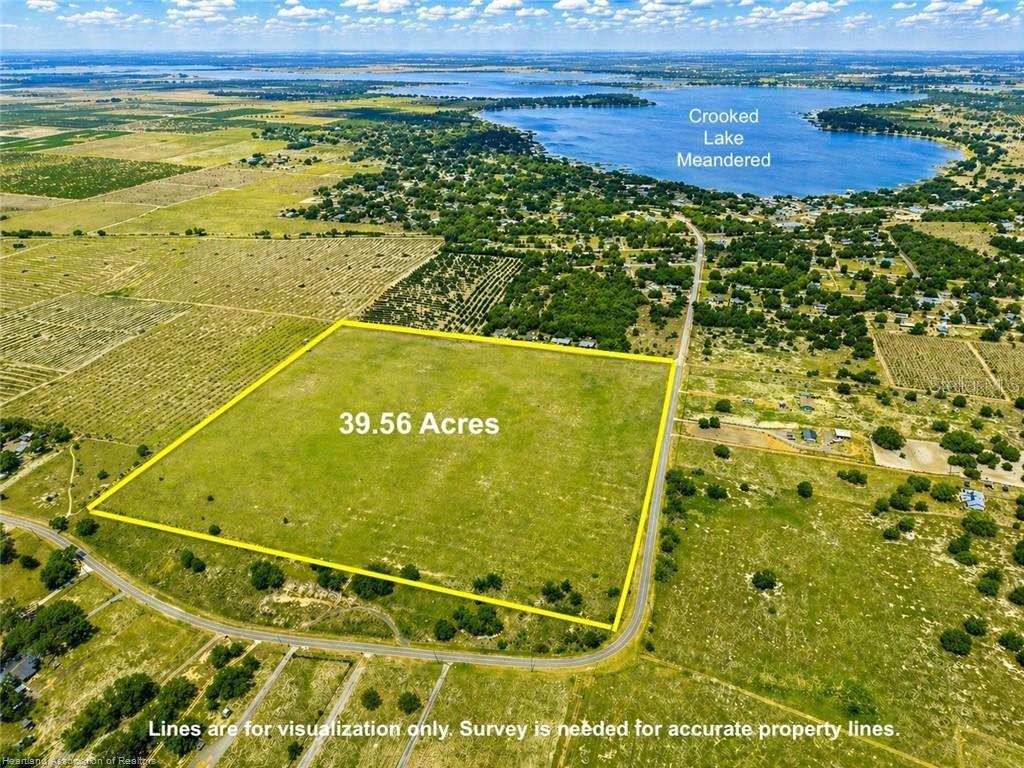 An aerial view shows a large, rectangular 39.56-acre plot of land near Crooked Lake — LAKE PATRICK ROAD N, BABSON PARK, FL