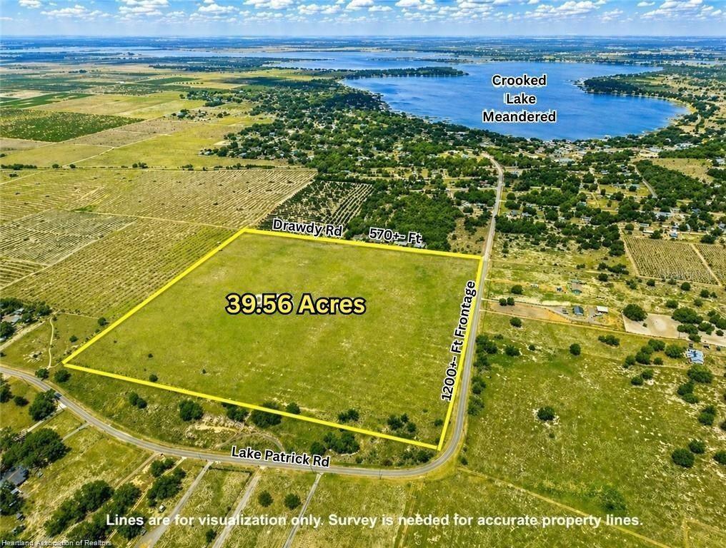 An aerial view shows a 39.56-acre plot of land bordered by two roads near a lake — LAKE PATRICK ROAD N, BABSON PARK, FL