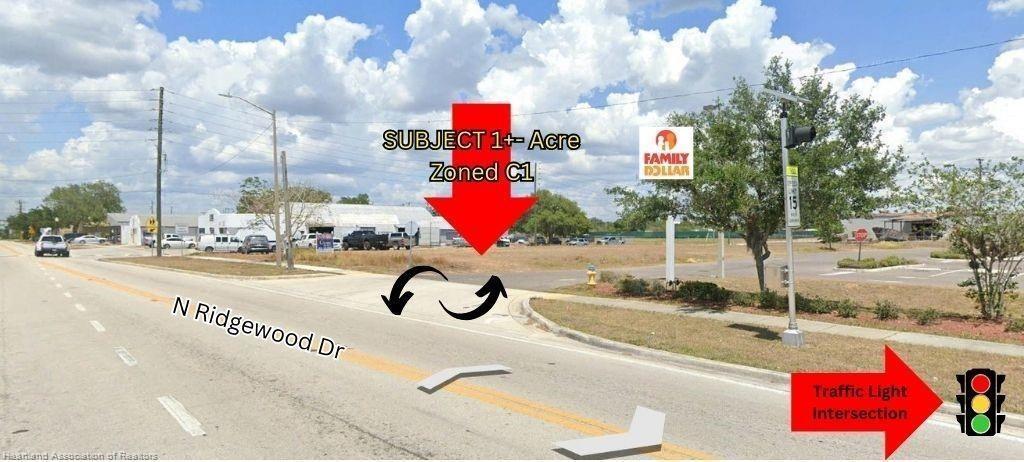A vacant lot with a red arrow pointing to it next to a Family Dollar store — 648 N Ridgewood Drive, Sebring FL 33870, SEBRING, FL