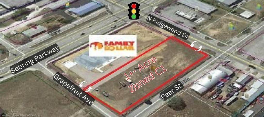 This aerial map shows a vacant, rectangular lot outlined in red at a street intersection — 648 N Ridgewood Drive, Sebring FL 33870, SEBRING, FL