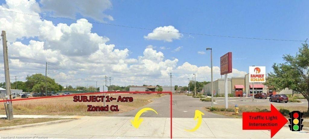 A vacant, rectangular lot is outlined in red next to a Family Dollar store — 648 N Ridgewood Drive, Sebring FL 33870, SEBRING, FL