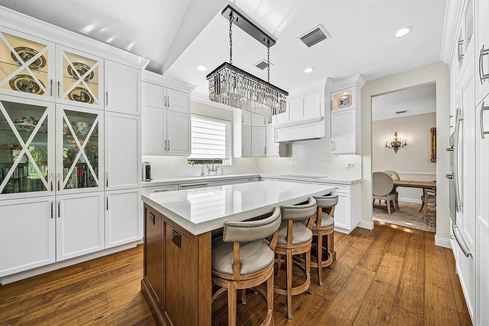 An aerial view of a two-story house with a tiled roof, pool, and paved driveway — 4361 Gleneagles Drive, Boynton Beach FL 33436, BOYNTON BEACH, FL