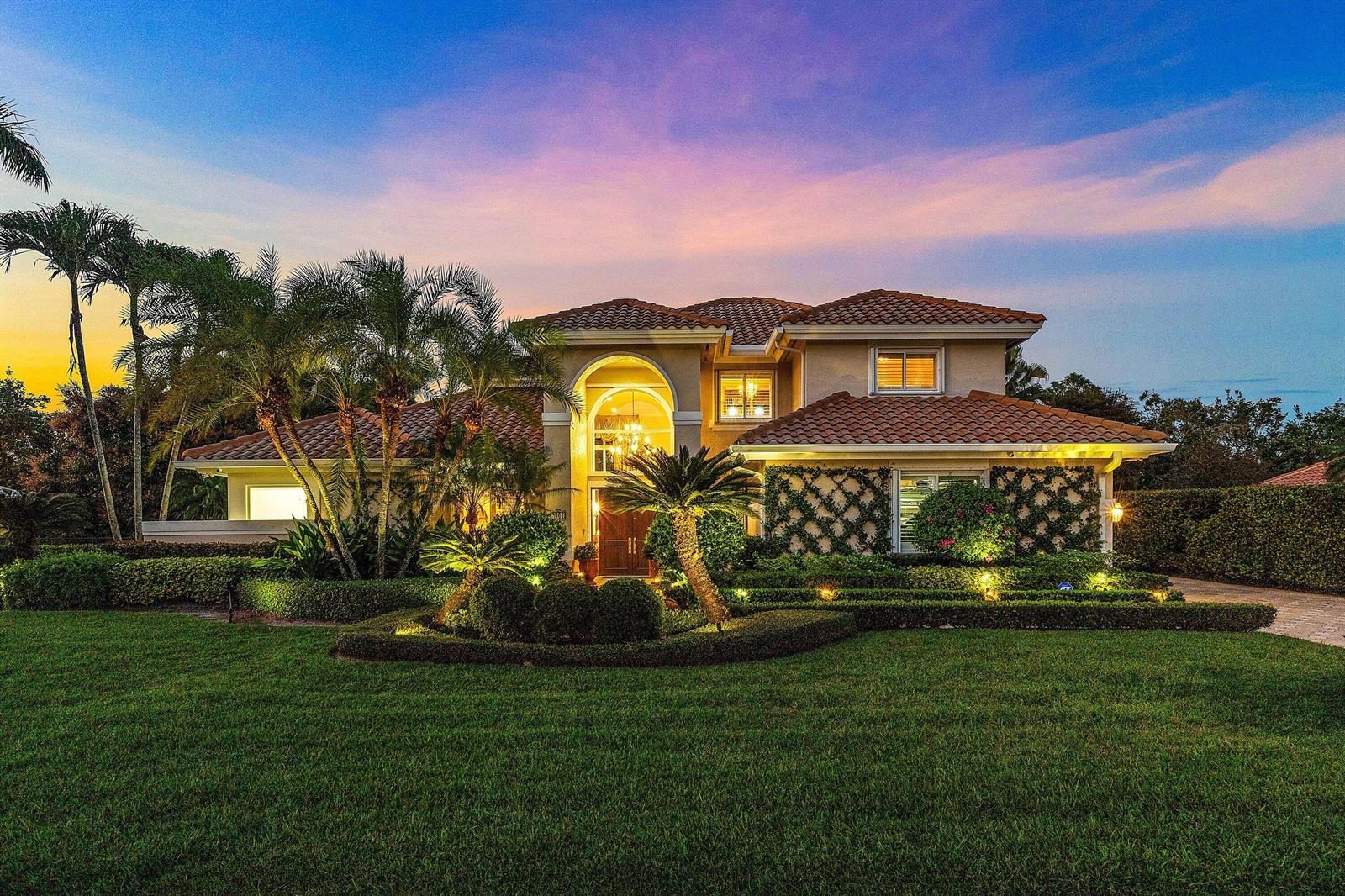 A two-story house with a tiled roof, arched entryway, and landscaped front lawn — 4361 Gleneagles Drive, Boynton Beach FL 33436, BOYNTON BEACH, FL