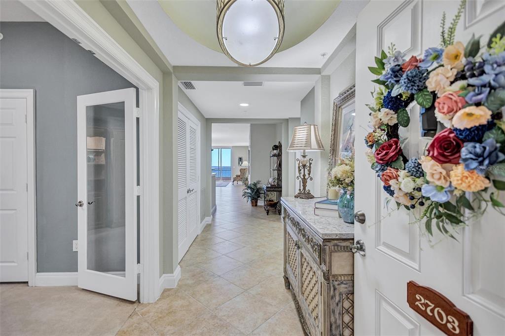 A tiled entryway leads to a hallway with a view of the ocean beyond — 2925 TERRA CEIA BAY BOULEVARD UNIT 2703, PALMETTO, FL