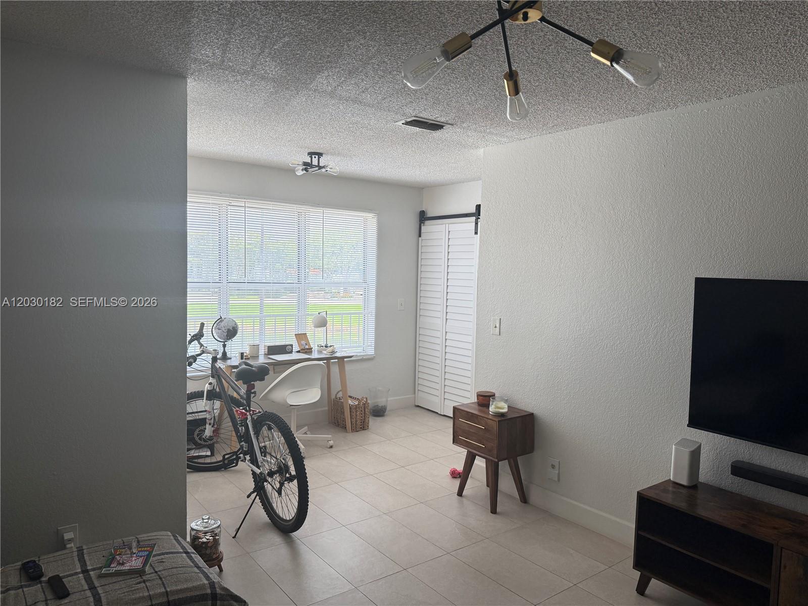 A bathroom features a white vanity, a vessel sink, a toilet, and a tiled tub — 3330 N Pinewalk Dr N # 1623, Margate FL 33063, MARGATE, FL