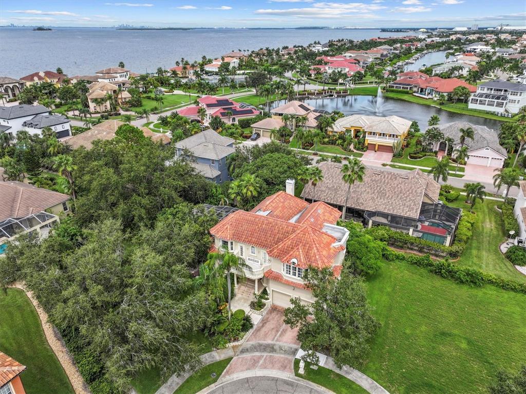 An aerial view of a two-story house with a red tile roof and a driveway — 5914 LA ROSA LANE, APOLLO BEACH, FL