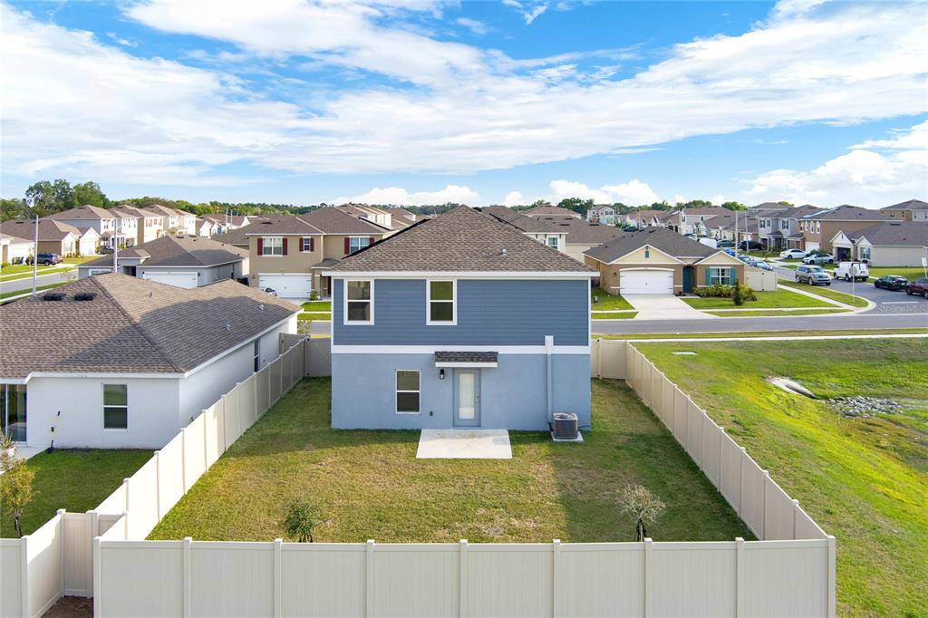 A bathroom features a double vanity with white cabinets and a large mirror — 271 INMAN BOULEVARD, WINTER HAVEN, FL