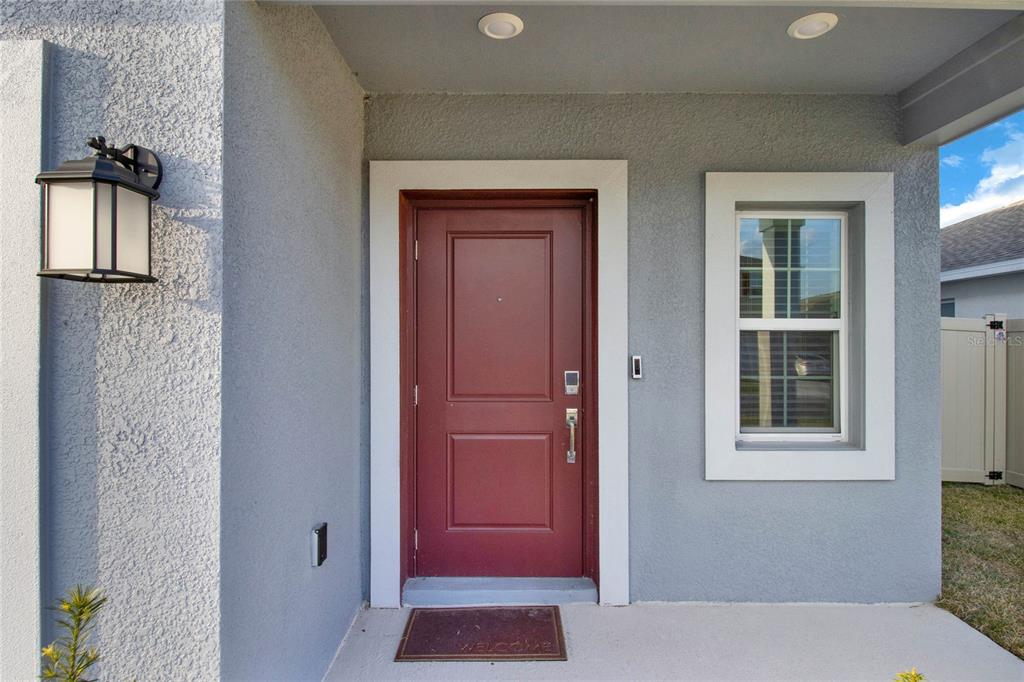 An aerial view of the rear exterior of a two-story house with a fenced yard — 271 INMAN BOULEVARD, WINTER HAVEN, FL