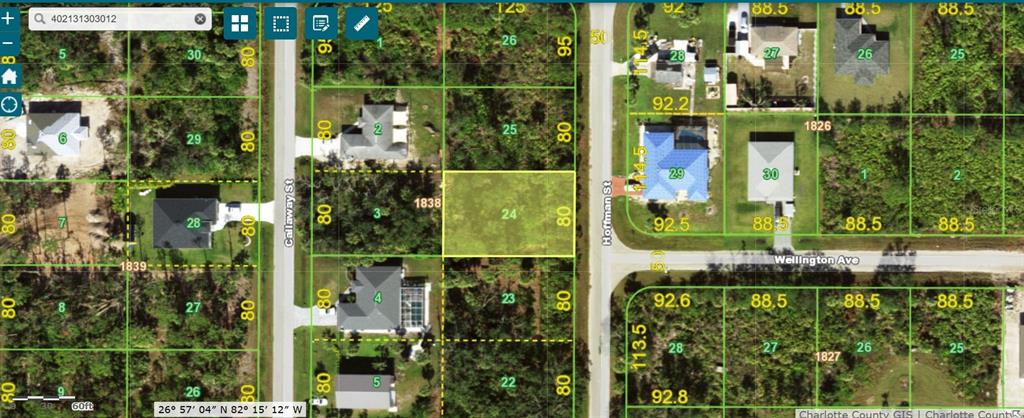 This is a satellite map showing a highlighted vacant residential lot in a suburban neighborhood — 5299 HOFFMAN STREET, PORT CHARLOTTE, FL