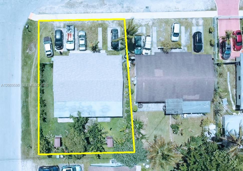This aerial view shows a residential property with a house, driveway, and backyard — 14615 NE 14th Ave, Miami FL 33161, MIAMI, FL