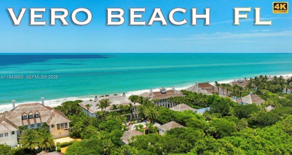 An aerial view of beachfront houses surrounded by trees along the coast in Vero Beach — 8966 101st Ct, Vero Beach FL 32967, VERO BEACH, FL