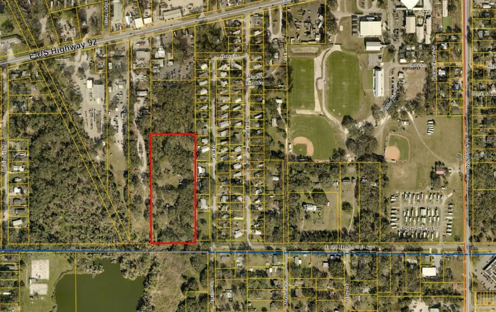 This is an aerial map showing a rectangular parcel of land outlined in red — 11308 E OLD HILLSBOROUGH AVENUE, SEFFNER, FL