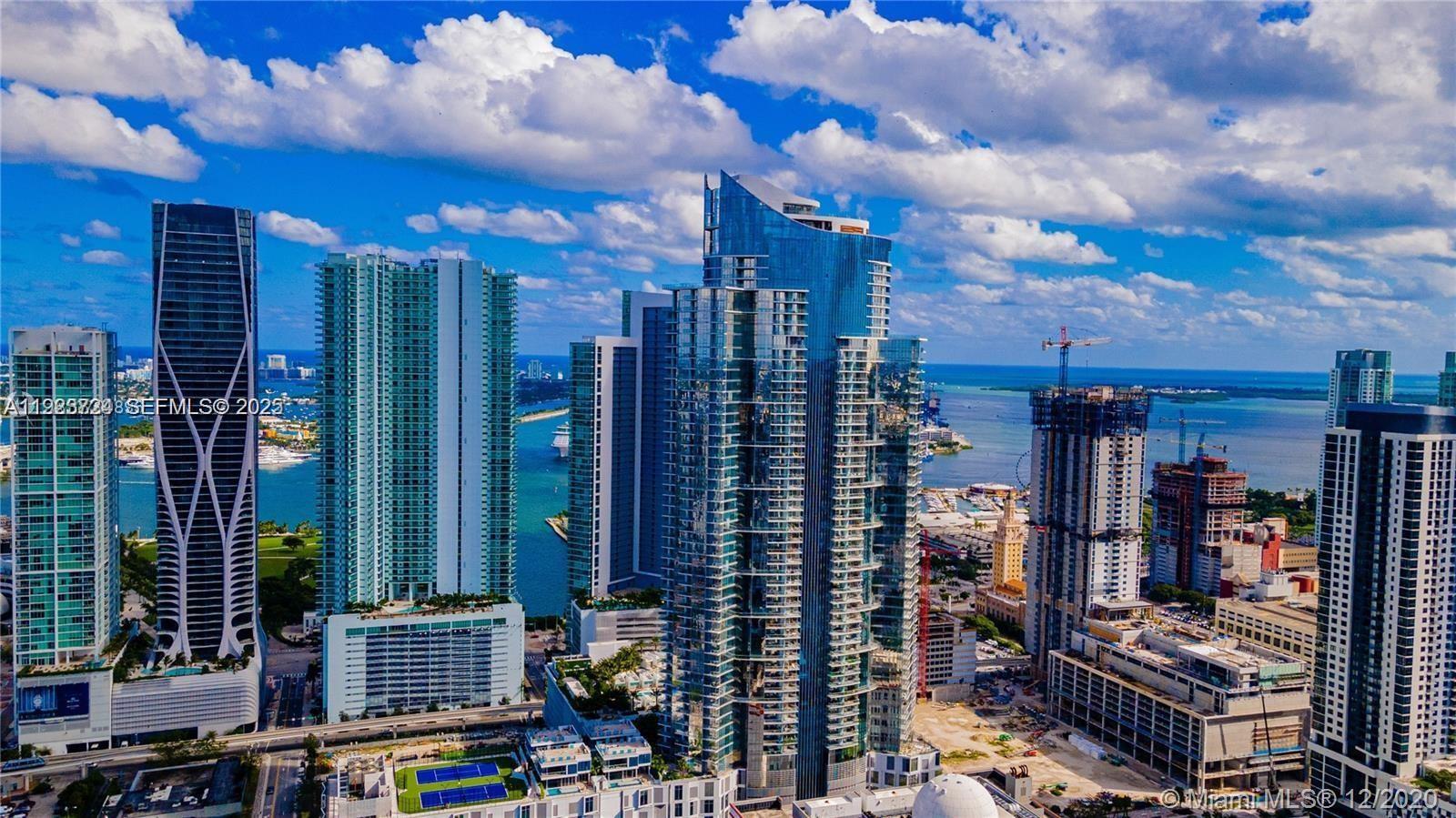 An aerial view of high-rise residential towers and construction sites along the Miami waterfront — 851 NE 1st Ave # 4911, Miami FL 33132, MIAMI, FL
