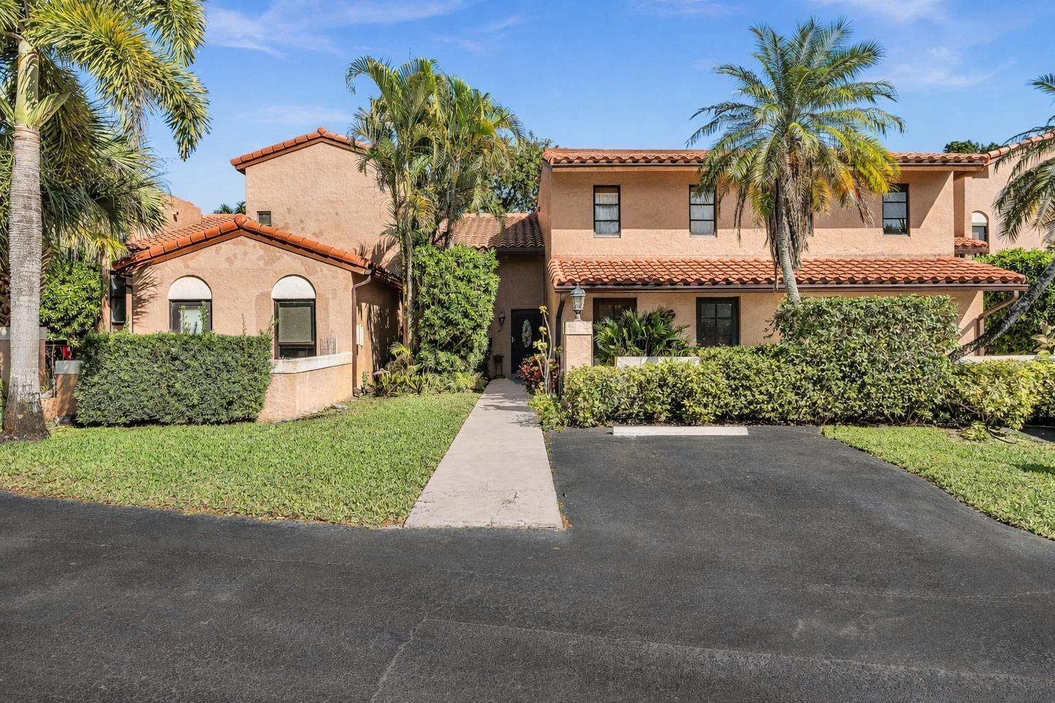 A two-story stucco house with a tile roof, palm trees, and a paved driveway — 9050 Jacaranda Lane # 3, Plantation FL 33324, PLANTATION, FL