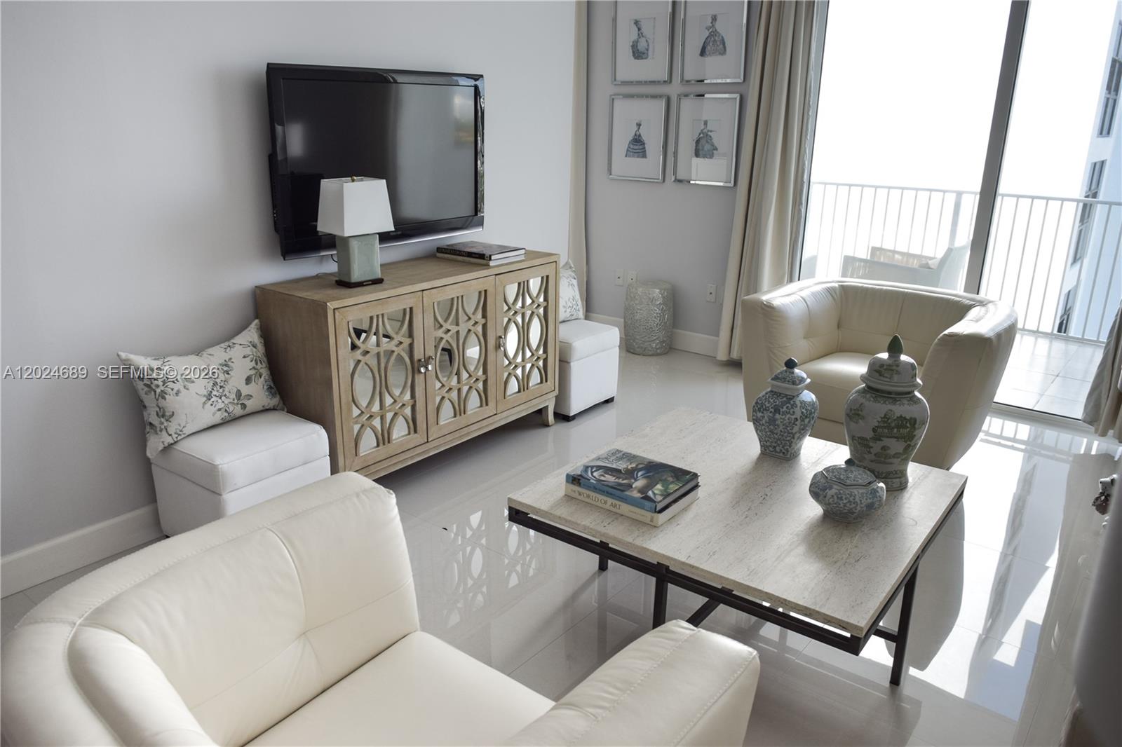 A living room features white leather armchairs, a mirrored console, and a stone coffee table — 3180 SW 22nd Ter, Miami FL 33145, MIAMI, FL